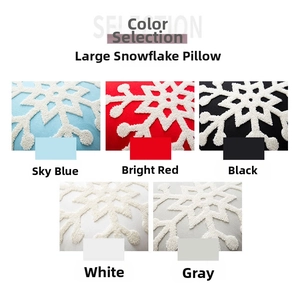 Close-up of tufted white snowflake embroidery on soft textured pillow covers