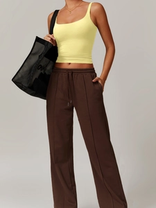 Y2K yoga set with yellow tank top and brown wide-leg high-waist drawstring joggers