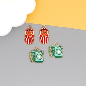 Retro DIY enamel charms featuring Russian dolls and vintage telephones for jewelry making