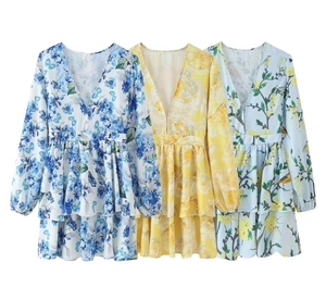 Detailed flat lay of V-neck floral dresses with layered ruffle skirts in three colors