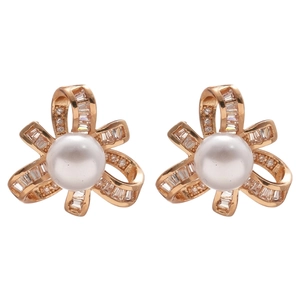 Elegant gold pearl stud earrings with zircon floral ribbon design on white background