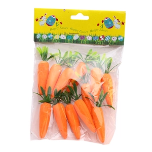Artificial foam carrots for Easter decoration in clear packaging with green leaves