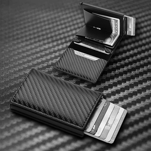 Detailed internal view of carbon fiber RFID wallet with cash slot and card ejector