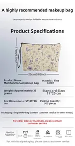 Detail of floral makeup bag showing 17x25cm size, zipper closure and linen texture