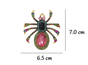 Detailed size view of retro spider brooch with pink oval crystal and colorful rhinestones