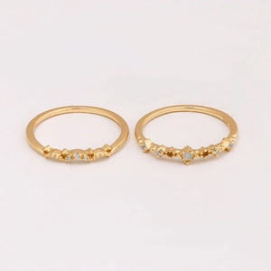 Detail of S925 gold plated silver rings with opal stone and sparkling diamond accents