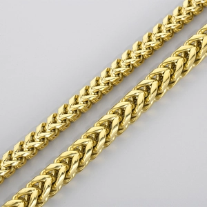 Detailed view of two gold stainless steel dragon bone chain bracelets with woven metal texture