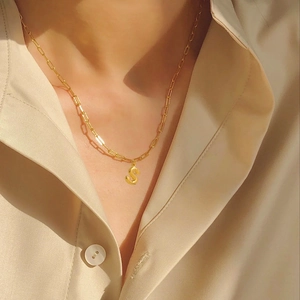 Polished gold paperclip chain necklace with a 3D bubble letter S pendant for women