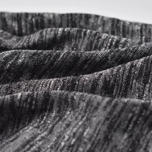 Macro shot of breathable heather grey knit fabric texture with soft natural draping