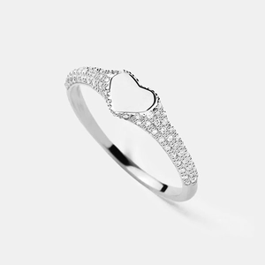 Macro shot of 925 silver heart signet ring with micro-pave crystals on the band
