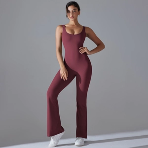 Detail of burgundy flare leg yoga jumpsuit with professional silhouette and athletic fit