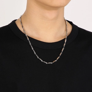 Silver geometric prism bar chain necklace made of stainless steel worn by male model