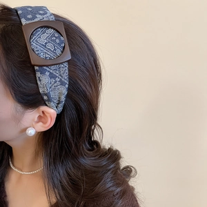 Detail of blue Paisley print fabric headband with vintage brown matte square buckle