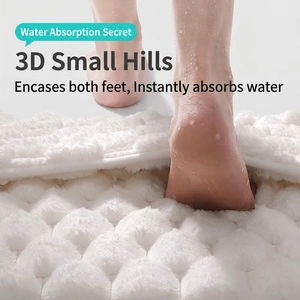 Absorbent memory foam bath mat with 3D embossed pebble texture for quick drying
