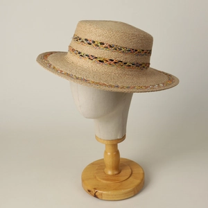 Elegant raffia boater hat with colorful handwoven ethnic band for summer sun protection