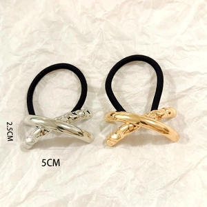 Detailed view of gold and silver hollow metal hair ties with 5cm length dimensions