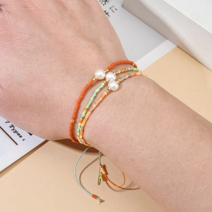Bohemian seed bead bracelet set with natural freshwater pearls and adjustable gold cord