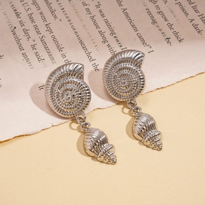 Silver nautilus shell earrings with pleated texture and vintage sea-inspired design