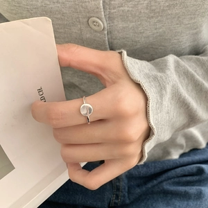 Minimalist S925 sterling silver ring with polished circular disk shown on model's hand