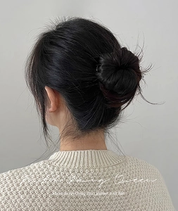 U-shaped hair pin for French twist bun shown on model with sleek dark hair