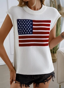 Detail of white sleeveless knit top featuring an American flag pattern on the chest