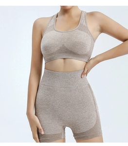 Detailed close-up of high-waist yoga shorts with breathable mesh panels in oatmeal marl