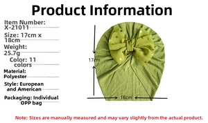 Detail of infant turban hat in grass green with oversized gold dot bow and size chart
