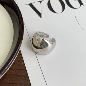 Macro detail of S925 sterling silver stamp on a minimalist polished open ring band