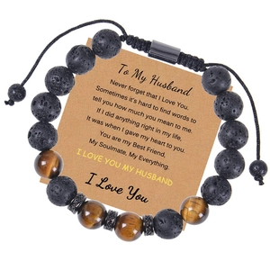 Detail of 10mm tiger eye and lava stone beads on woven bracelet with sentiment card