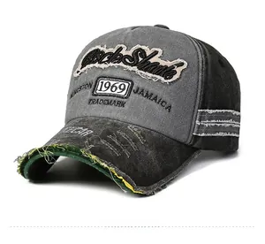 Detailed close-up of distressed cotton baseball cap with 1969 embroidery and frayed edges