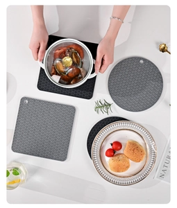 Detail of square and round heat-resistant silicone mats with Japanese wave pattern