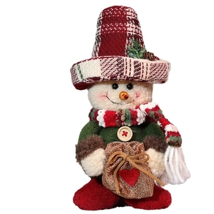 Christmas snowman plush doll with plaid hat and green shirt on a red base decoration