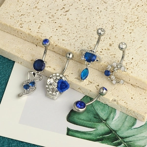 Detailed set of blue zircon navel rings featuring moon, saturn, and heart charms
