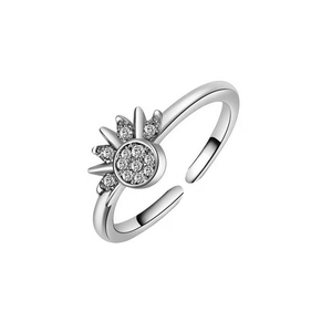 Detailed close-up of a silver sun-shaped open ring featuring micro-pave crystals and zircon