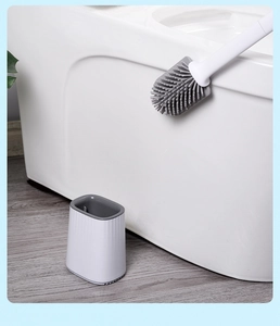 Close-up of TPR silicone toilet brush cleaning the rim with breathable base stand