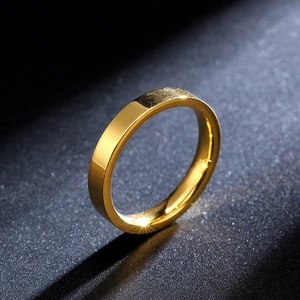 Minimalist 3mm gold titanium steel ring with polished finish on grey background