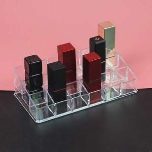 Transparent acrylic 24-slot lipstick display stand with tiered trapezoidal storage design