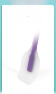 Detail showing high flexibility of the purple and white silicone spatula for baking