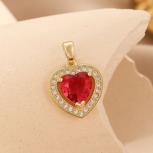 Golden heart pendant featuring a red center stone and clear zircon accents on a neutral base