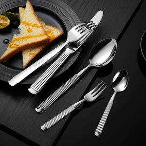 5-piece silver stainless steel cutlery set with vertical striped handles on black background