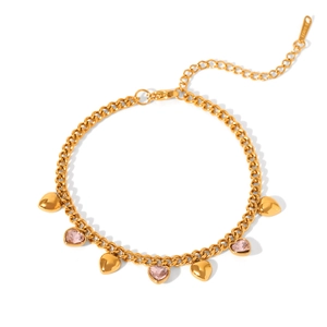 Detail of gold stainless steel chain featuring pink crystal hearts and polished charms