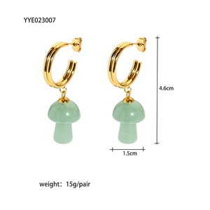 Detail view of gold C-shape earrings with green stone mushroom charms showing dimensions