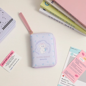 Detail of light purple PU leather coin purse with cartoon dog and pink wrist strap