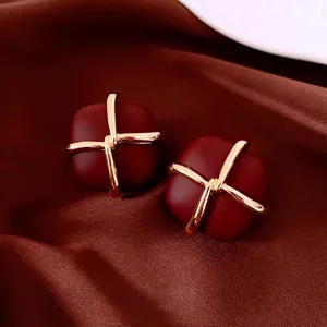 French vintage dark red square earrings with gold cross detail and matte gold finish