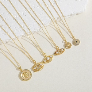 Gold evil eye and virgin mary shell pendant necklaces with zircon and pearls on stones