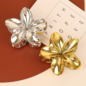 Elegant gold and silver floral hair claw clips with a polished metallic mirror finish