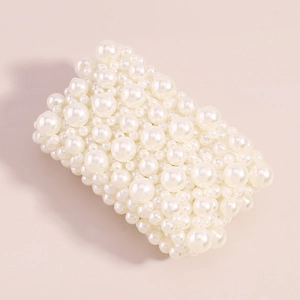 Detail of multi-row elastic pearl beaded wide bracelet with glossy cream finish