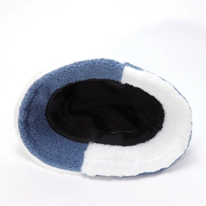 Close-up of the blue and white plush fabric texture and inner black lining of the bucket hat