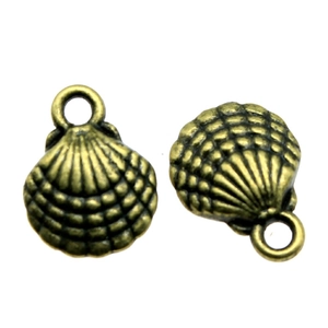 Macro detail of two bronze shell charms with textured surface for DIY jewelry making