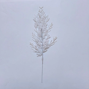 Macro shot of white artificial glitter pine branch decoration for Christmas tree decor